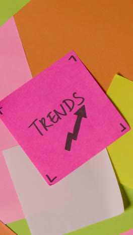 Vertical-Video-Business-Concept-Of-Revolving-Sticky-Notes-With-Trends-Written-On-Top-Note-1